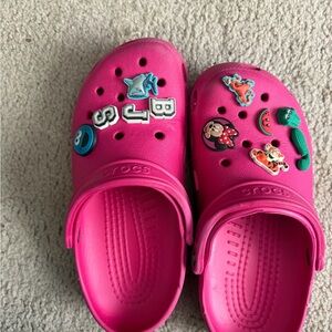 Crocs' Pink Clog Shoes with Character Charms